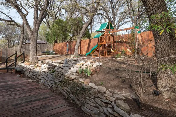a backyard of a house with lots of green space