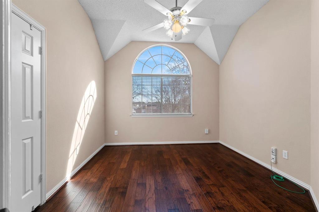 14588 Poe Court Addison, TX 75001 - Photo 24 of 28 a view of an empty room with wooden floor and a window