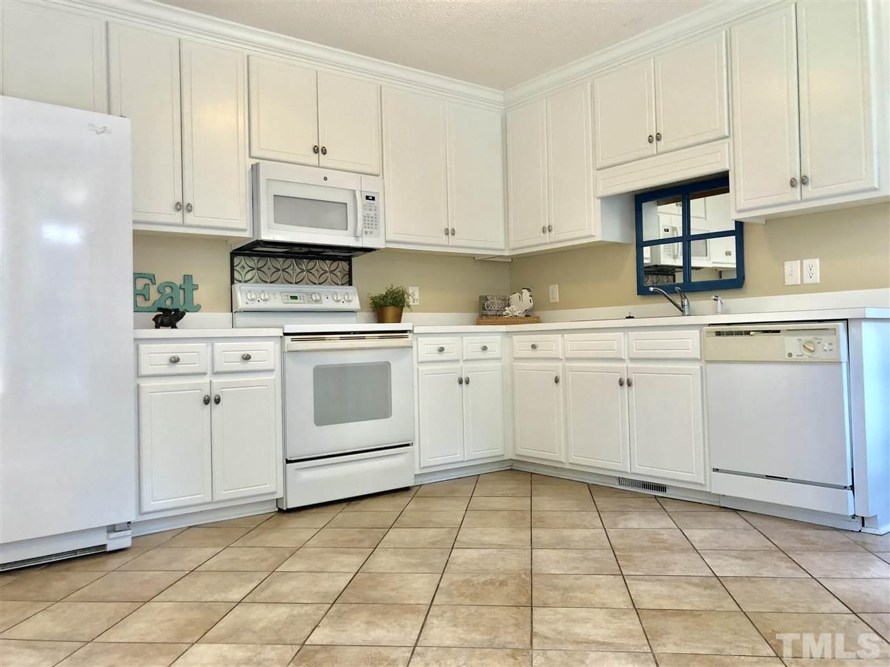 8211 Byrd Road Sims, NC 27880 - Photo 3 of 8 a kitchen with cabinets and appliances
