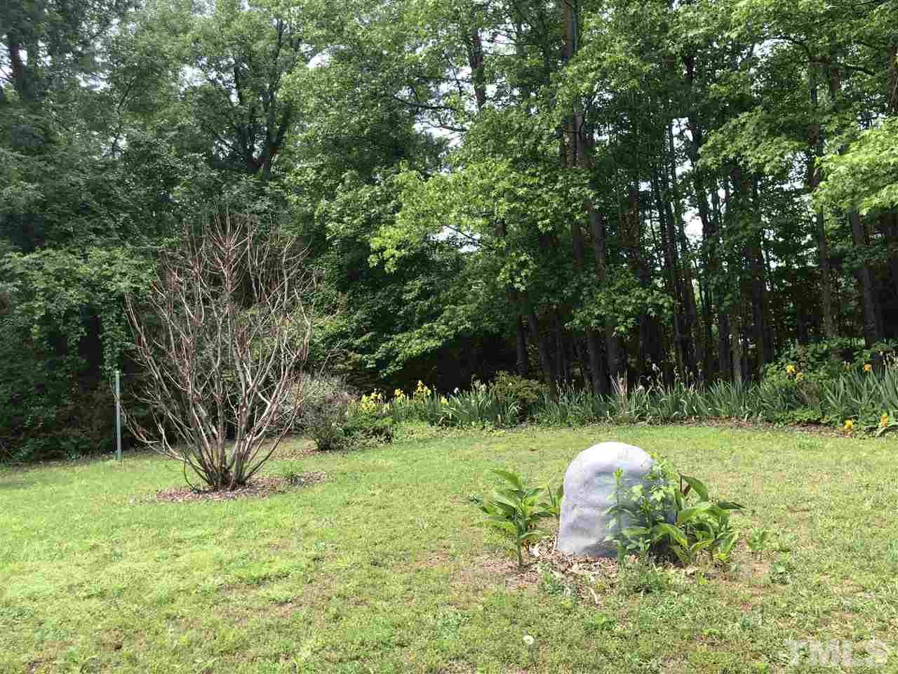 8211 Byrd Road Sims, NC 27880 - Photo 7 of 8 a view of a garden with a tree