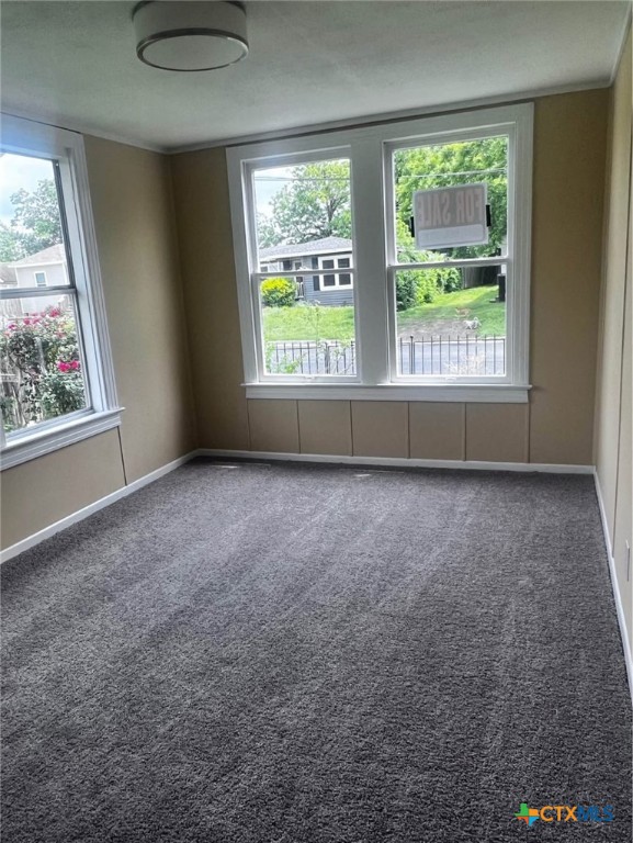 706 East Virginia Avenue Victoria, TX 77901 - Photo 9 of 9 an empty room with windows