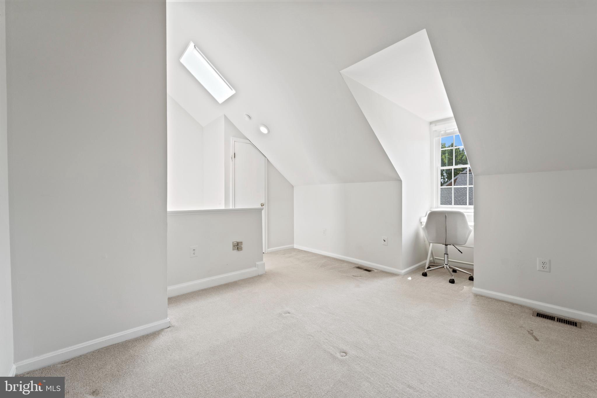 1235 Portner Road Alexandria, VA 22314 - Photo 17 of 23 a view of a livingroom with a staircase and white walls