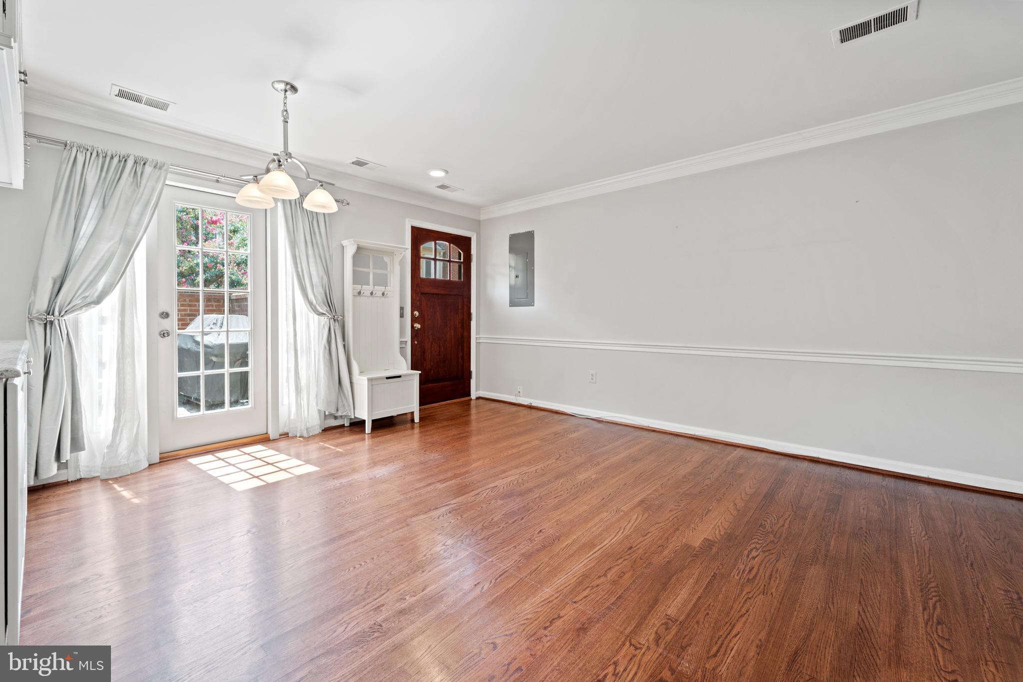 1235 Portner Road Alexandria, VA 22314 - Photo 5 of 23 a view of empty room with wooden floor and window