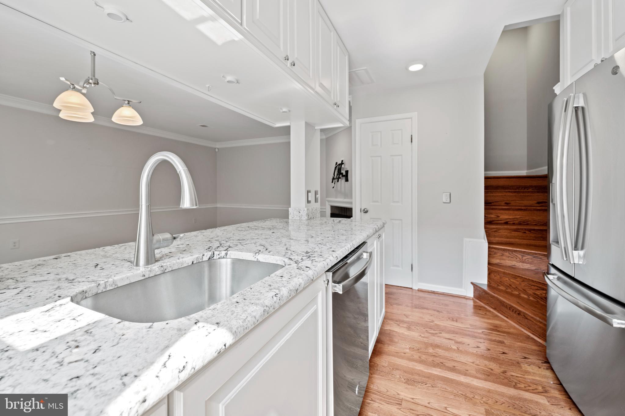1235 Portner Road Alexandria, VA 22314 - Photo 9 of 23 a kitchen with stainless steel appliances granite countertop a sink and a refrigerator