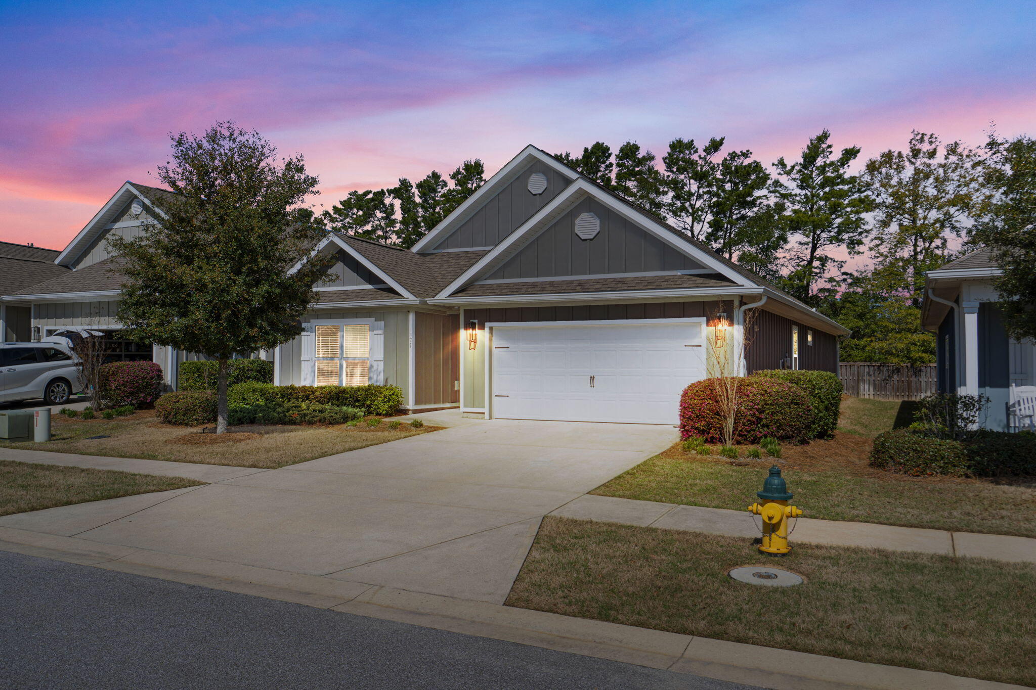 371 Lightning Bug Lane Freeport, FL 32439 - Photo 1 of 53 a front view of a house with street