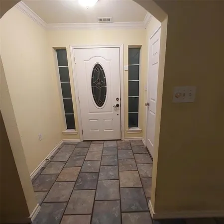a view of a bathroom with washing machine and sink