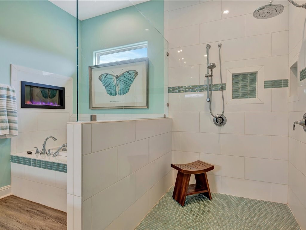 104 Wheeler Road Lufkin, TX 75901 - Photo 21 of 45 a bathroom with a bathtub and a shower