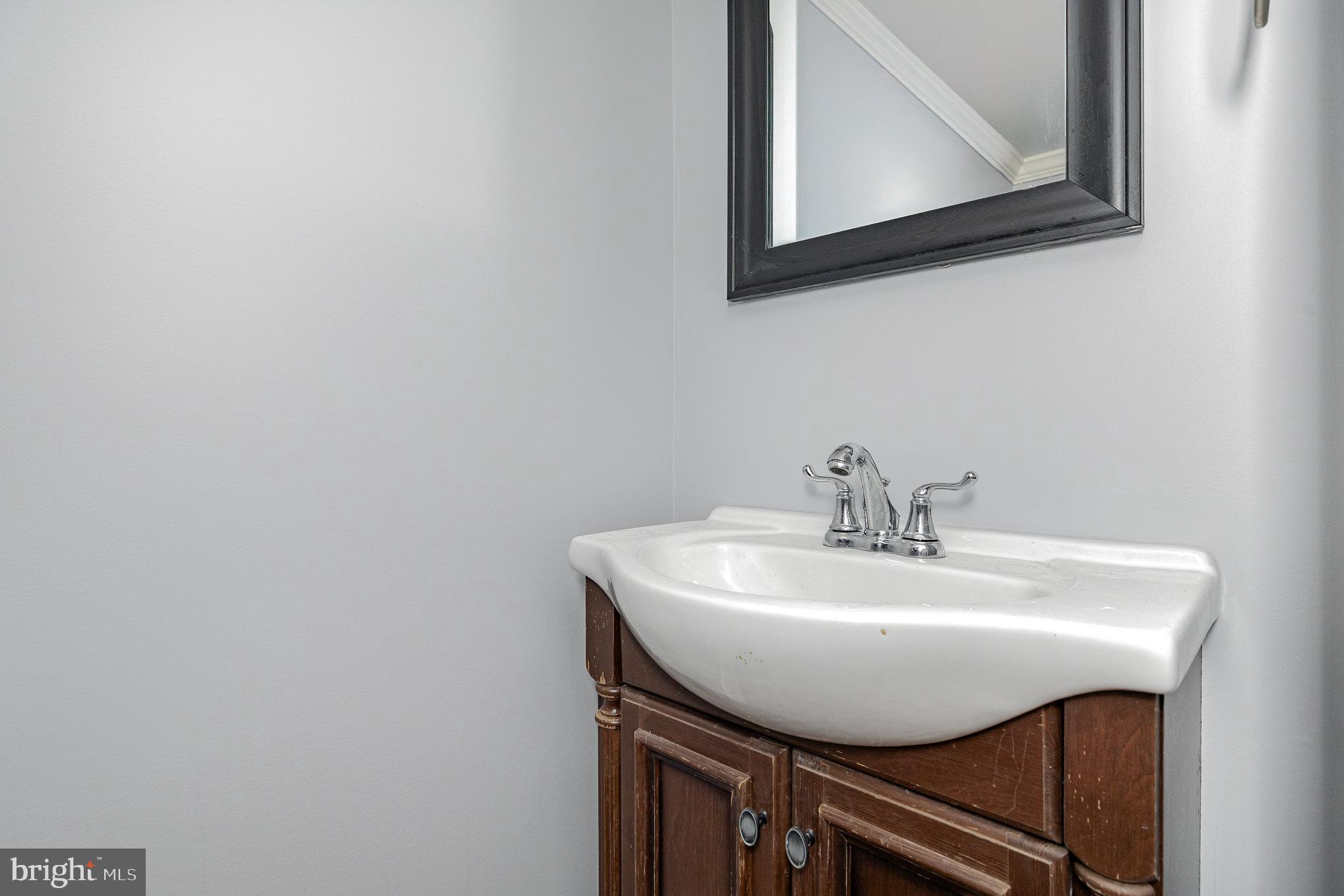 1030 White Oak Road Fredericksburg, VA 22405 - Photo 13 of 25 a bathroom with a sink and a mirror