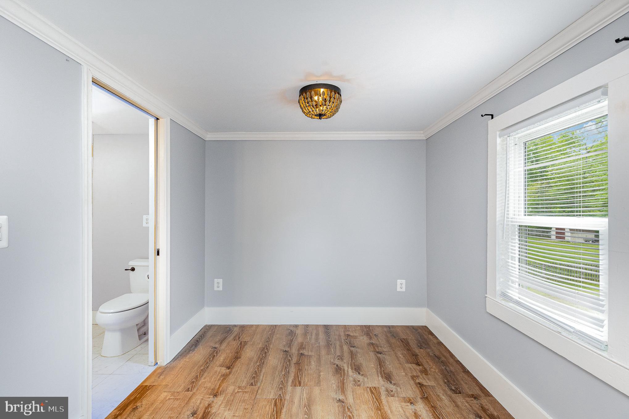 1030 White Oak Road Fredericksburg, VA 22405 - Photo 17 of 25 a view of room with window and wooden floor