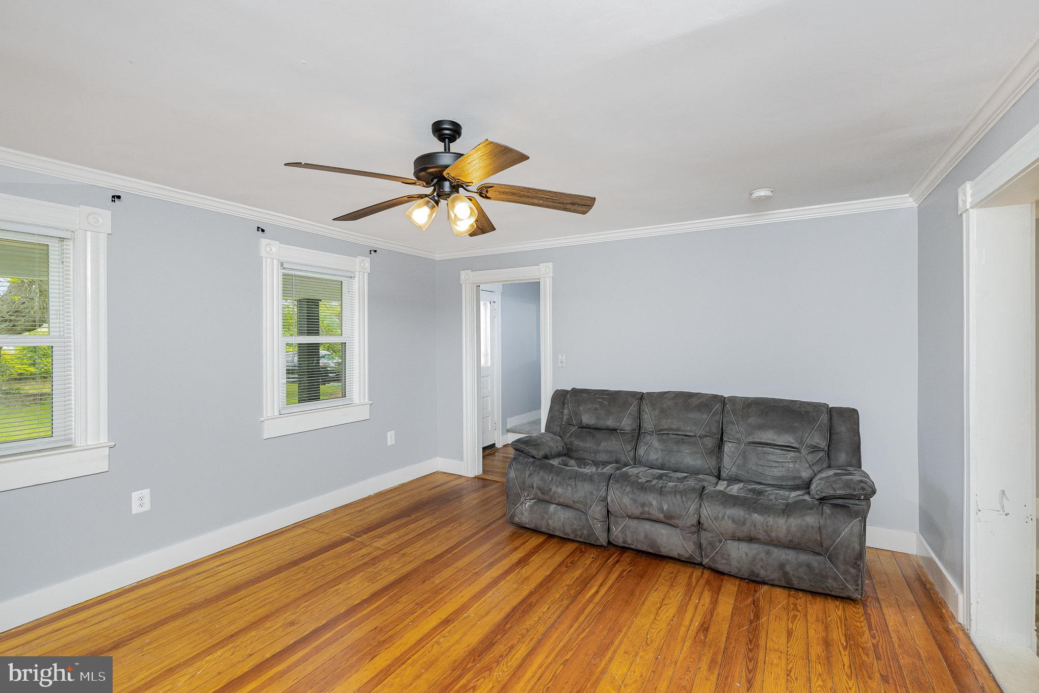 1030 White Oak Road Fredericksburg, VA 22405 - Photo 4 of 25 a living room with furniture and a wooden floor