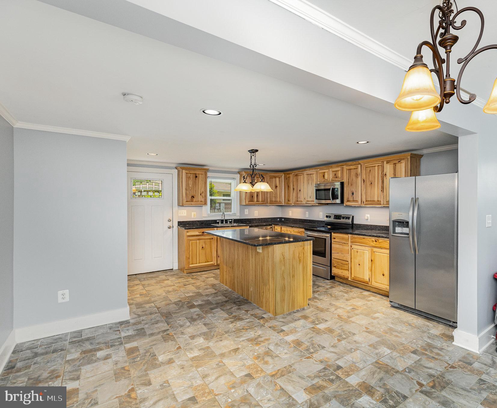 1030 White Oak Road Fredericksburg, VA 22405 - Photo 8 of 25 a kitchen with stainless steel appliances granite countertop a sink a stove cabinets and wooden floor