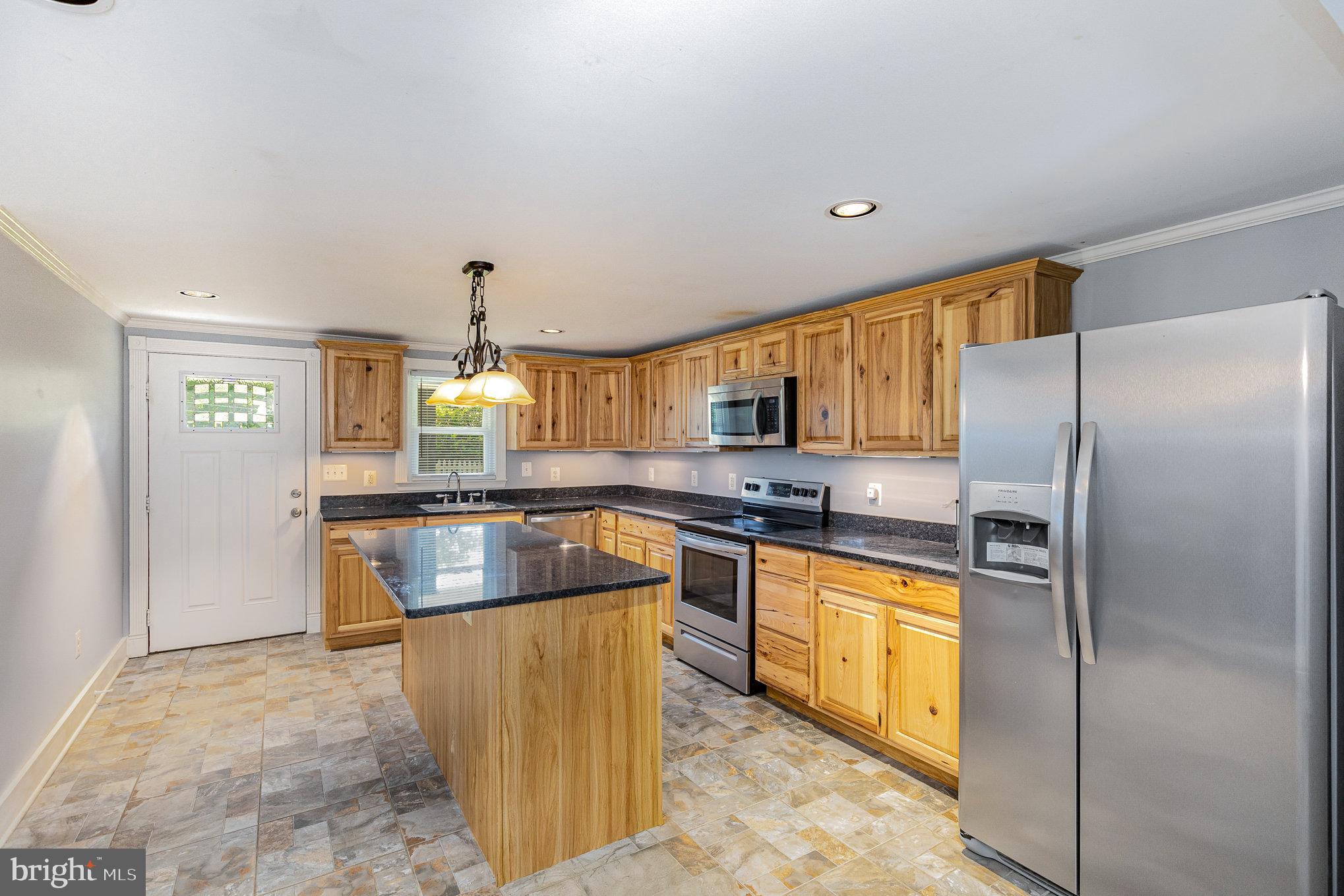 1030 White Oak Road Fredericksburg, VA 22405 - Photo 10 of 25 a kitchen with stainless steel appliances granite countertop a refrigerator a stove and a sink with cabinets