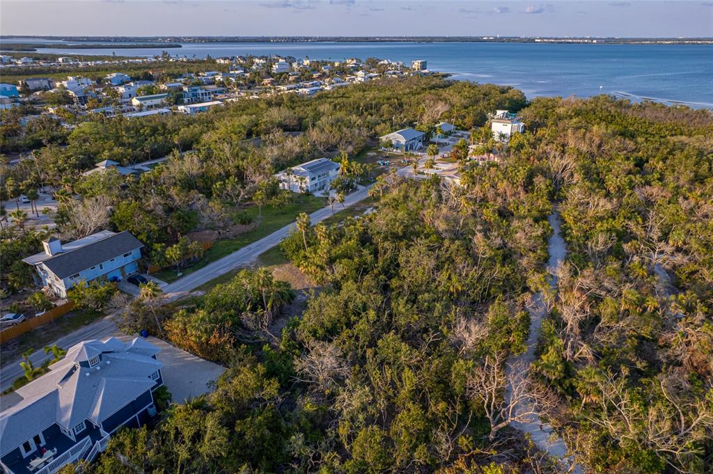 560 Gulf Bay Road Longboat Key, FL 34228 - Photo 24 of 38 an aerial view of residential houses with outdoor space