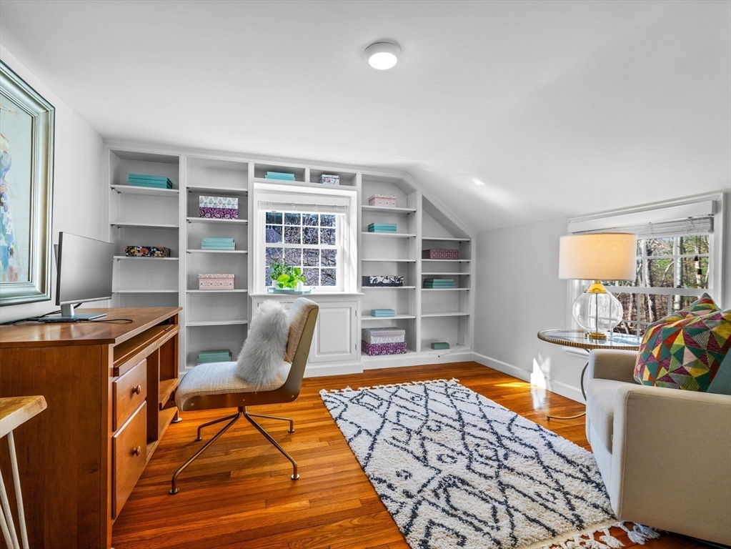 7 Madison Road Wellesley, MA 02481 - Photo 22 of 27 a living room with furniture and a book shelf