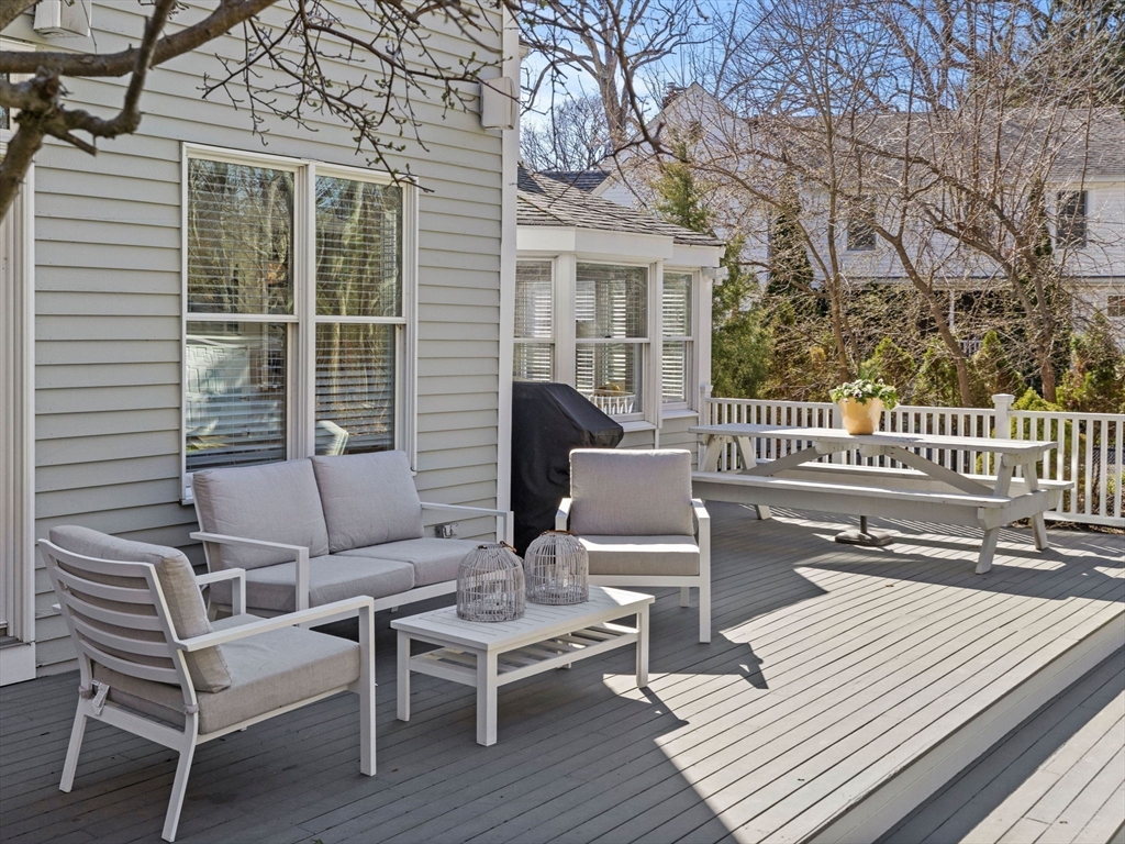 7 Madison Road Wellesley, MA 02481 - Photo 24 of 27 a view of a patio with a table and chairs