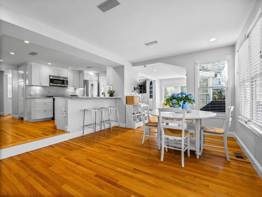7 Madison Road Wellesley, MA 02481 - Photo 4 of 27 a large kitchen with a table and chairs in it