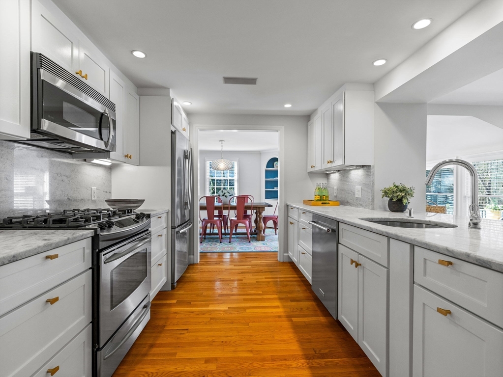 7 Madison Road Wellesley, MA 02481 - Photo 8 of 27 a large kitchen with stainless steel appliances granite countertop lots of counter top space a sink and dishwasher