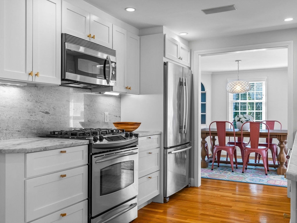 7 Madison Road Wellesley, MA 02481 - Photo 9 of 27 a kitchen with a stove a microwave and refrigerator