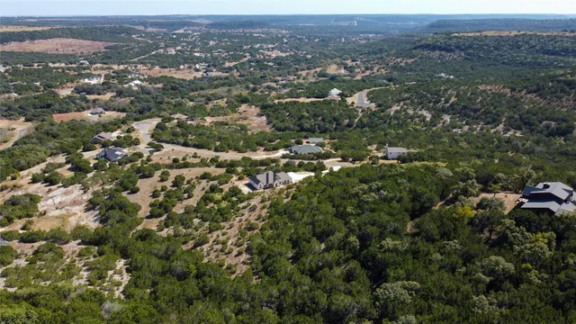 an aerial view of town with residential houses and green space