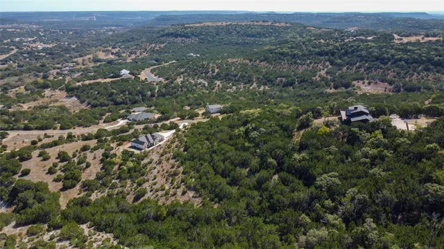 an aerial view of town with residential space and mountain view