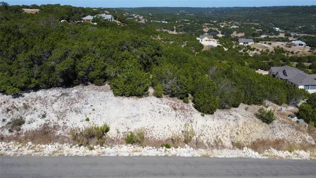 a view of a yard and mountain
