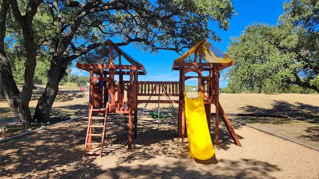 a view of a lake with houses in the back
