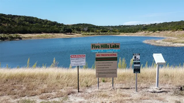 a view of a large body of water with a mountain view