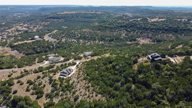 an aerial view of town with residential houses and green space