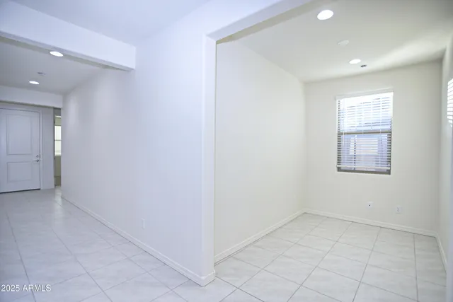 a view of a hallway with wooden shelves