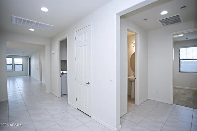 a white toilet sitting next to a bathroom sink