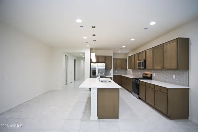 a kitchen with counter top space cabinets and stainless steel appliances