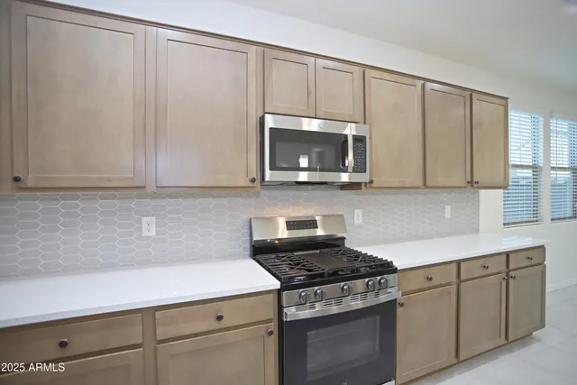 a view of cabinets and closet