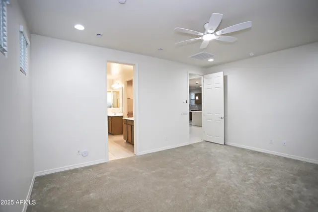 a bathroom with a shower and a sink