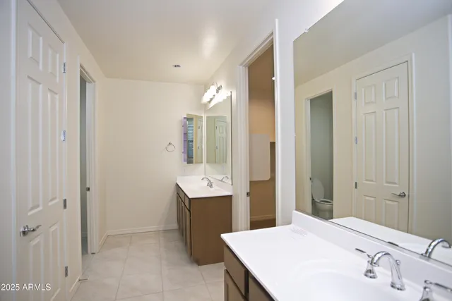 a bathroom with a sink vanity and a mirror