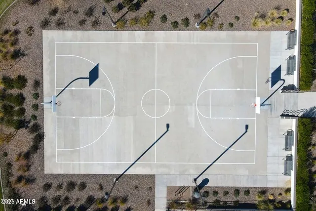an aerial view of a house with a yard and lake