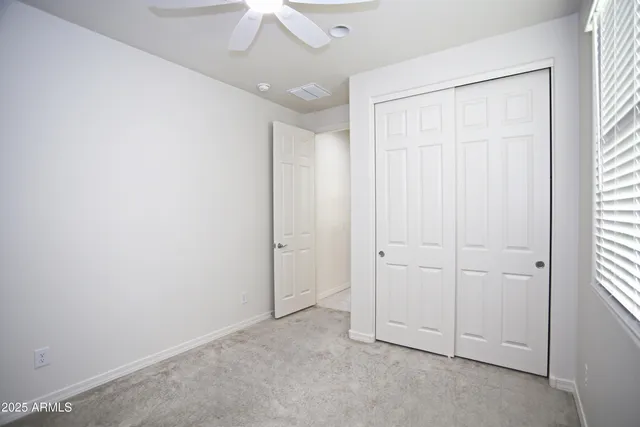 an empty room with a empty space and windows