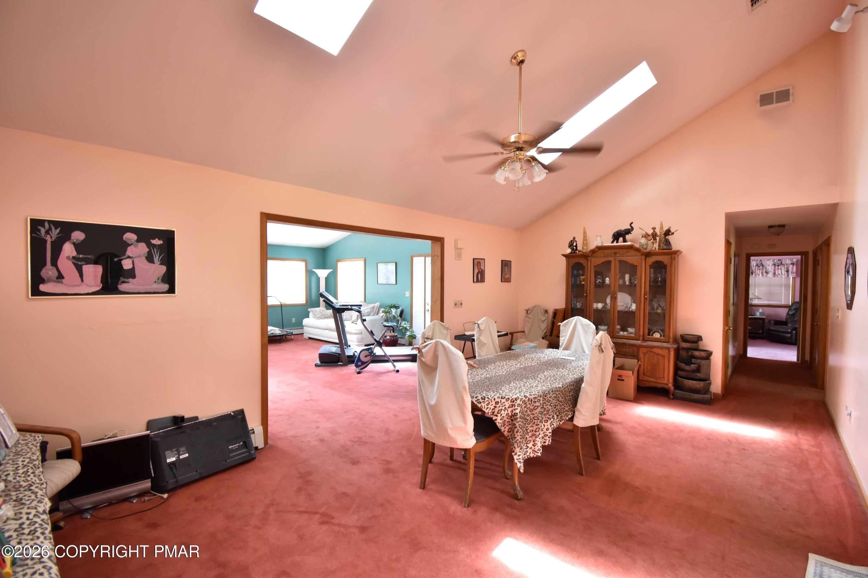 160 Quiet Valley Road Mount Bethel, PA 18343 - Photo 17 of 44 a living room with furniture and a chandelier