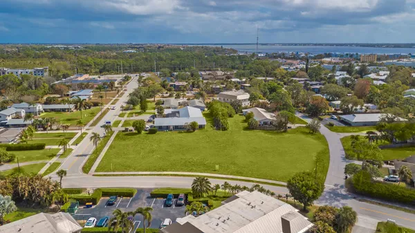 an aerial view of a residential houses with outdoor space