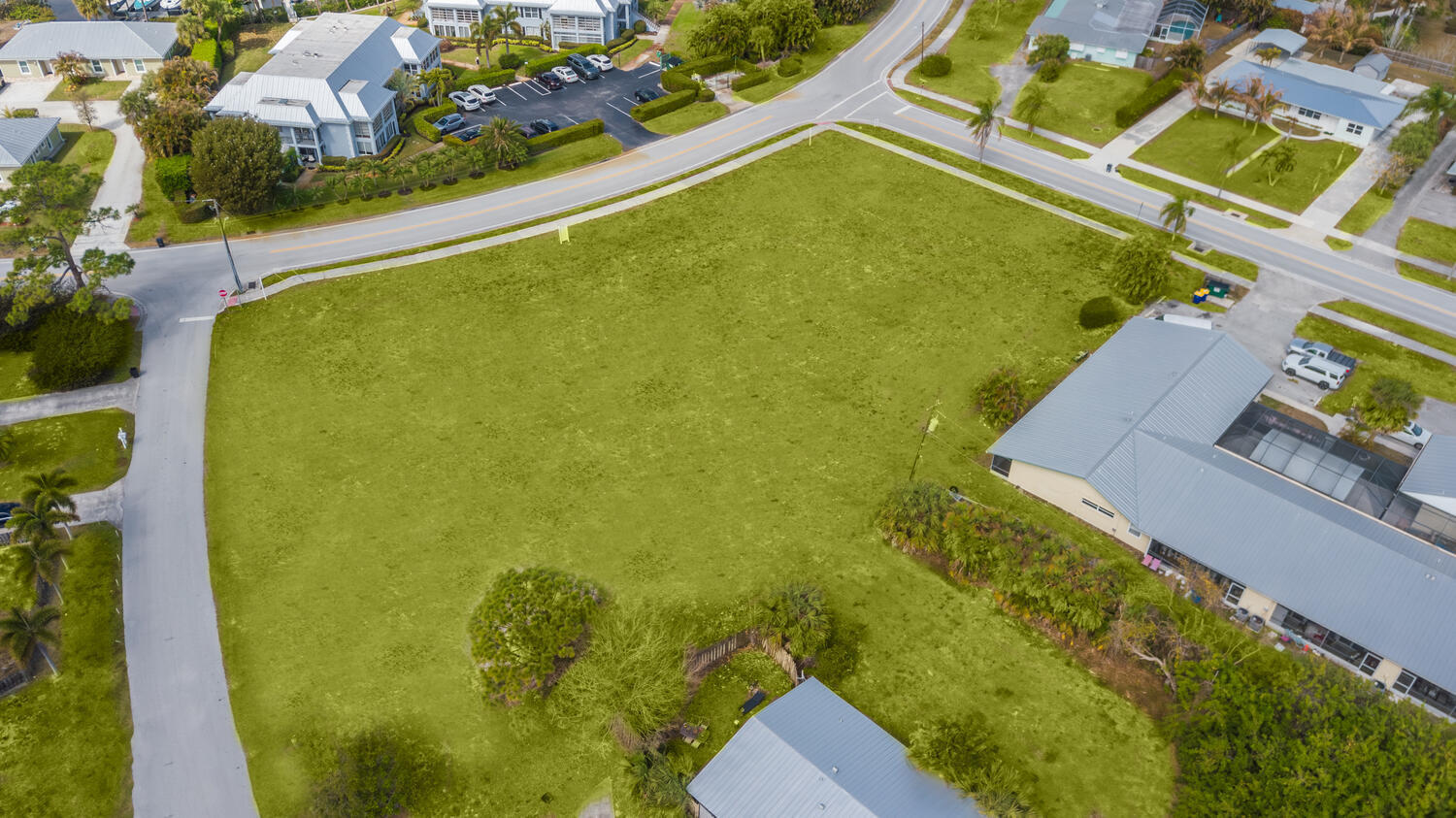 933-943 Northwest Spruce Ridge Drive Stuart, FL 34994 - Photo 3 of 6 an aerial view of a residential houses with outdoor space