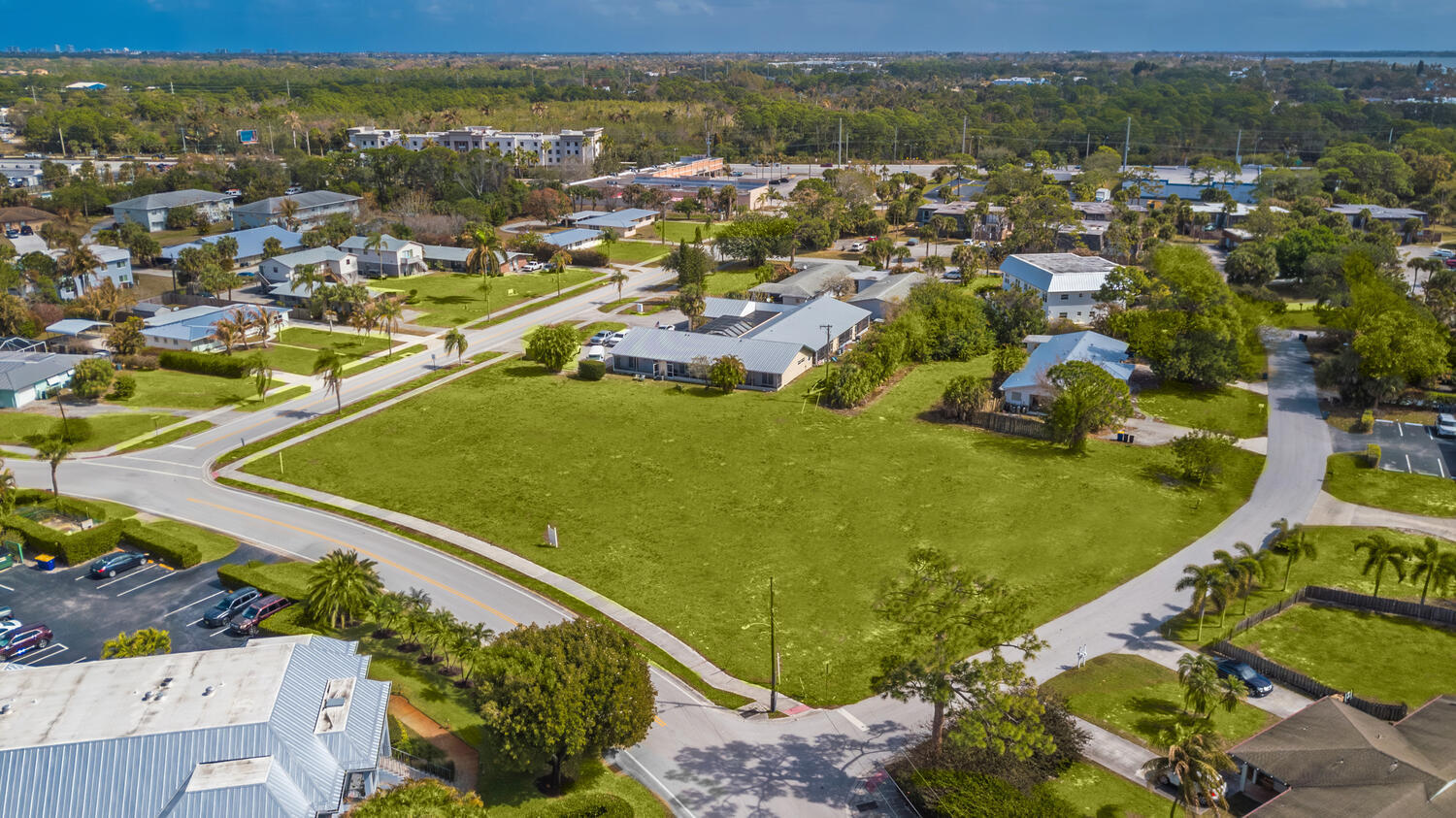 933-943 Northwest Spruce Ridge Drive Stuart, FL 34994 - Photo 4 of 6 an aerial view of residential houses with outdoor space
