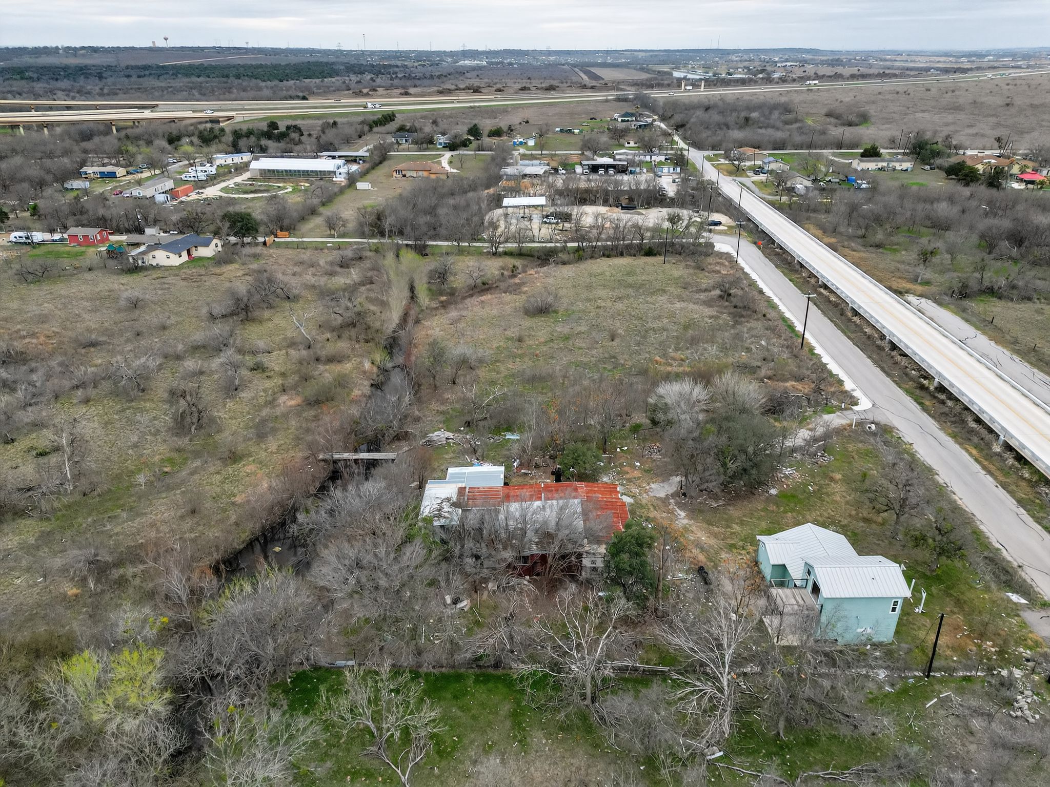 11223 Tom Sassman Road Austin, TX 78747 - Photo 24 of 40 Aerial view of property and surrounding area with rural landscape