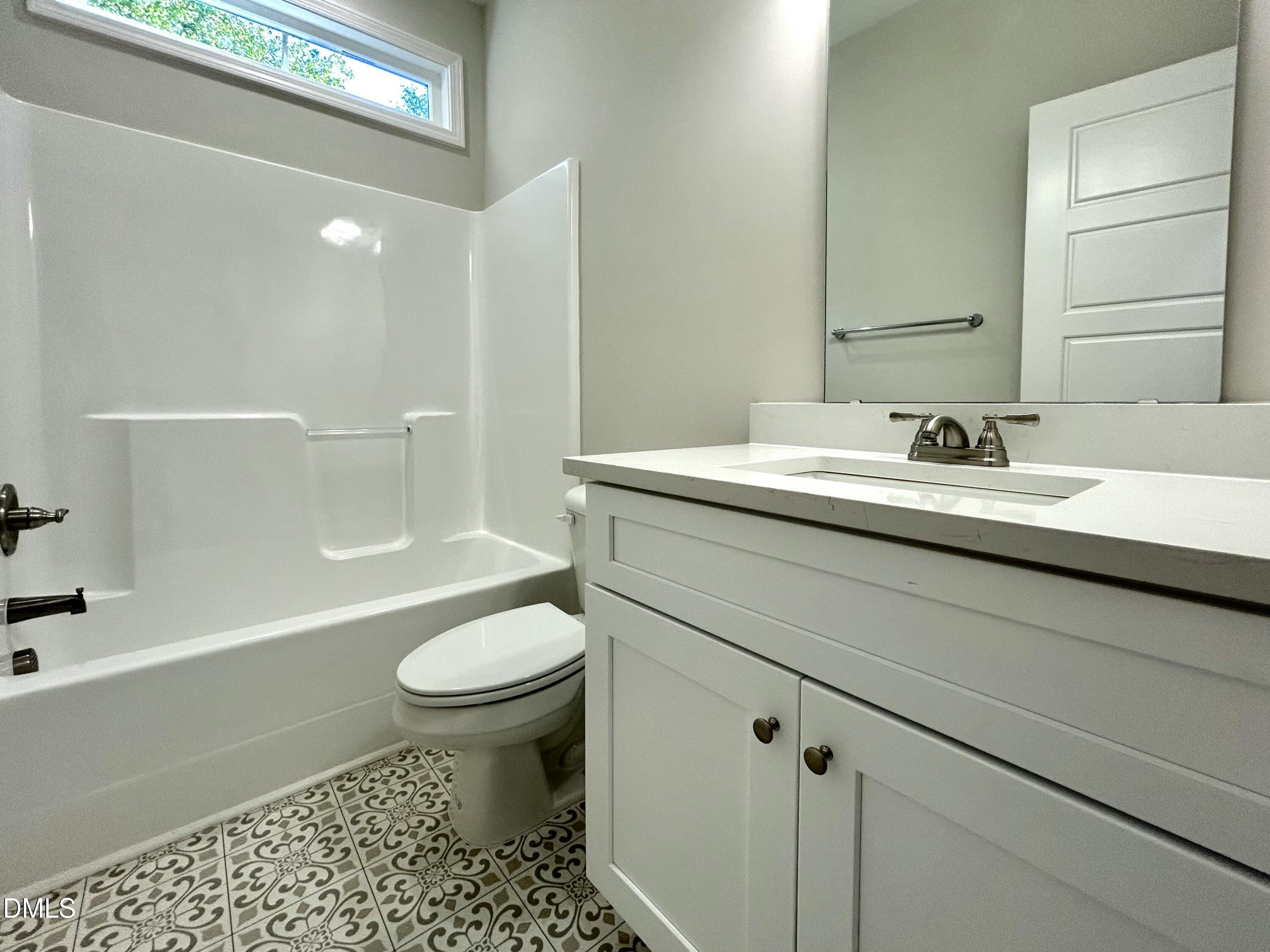 1702 Cardinal Drive Deep Run, NC 28525 - Photo 11 of 21 a bathroom with a sink a toilet and shower