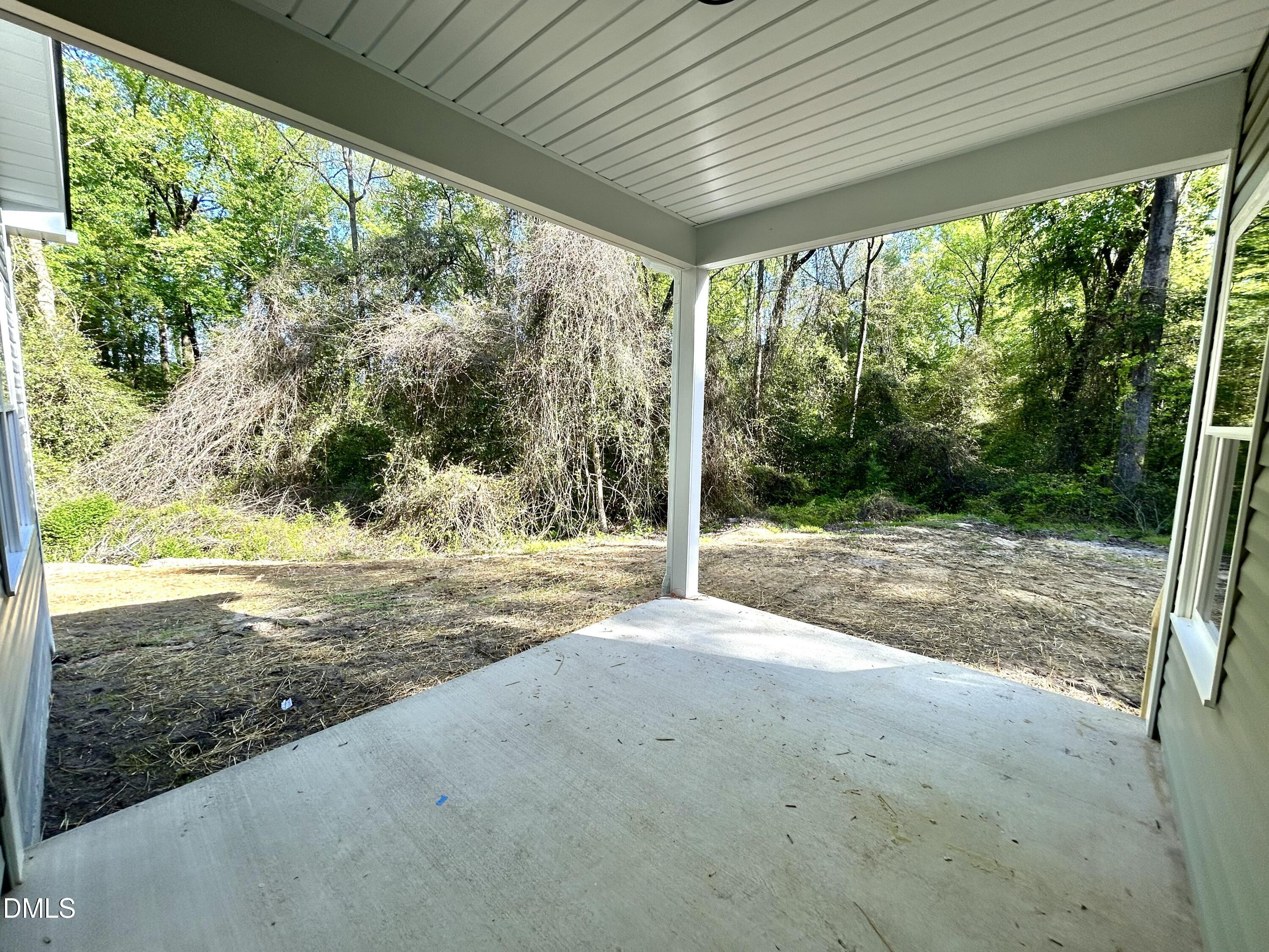 1702 Cardinal Drive Deep Run, NC 28525 - Photo 13 of 21 a view of backyard with green space