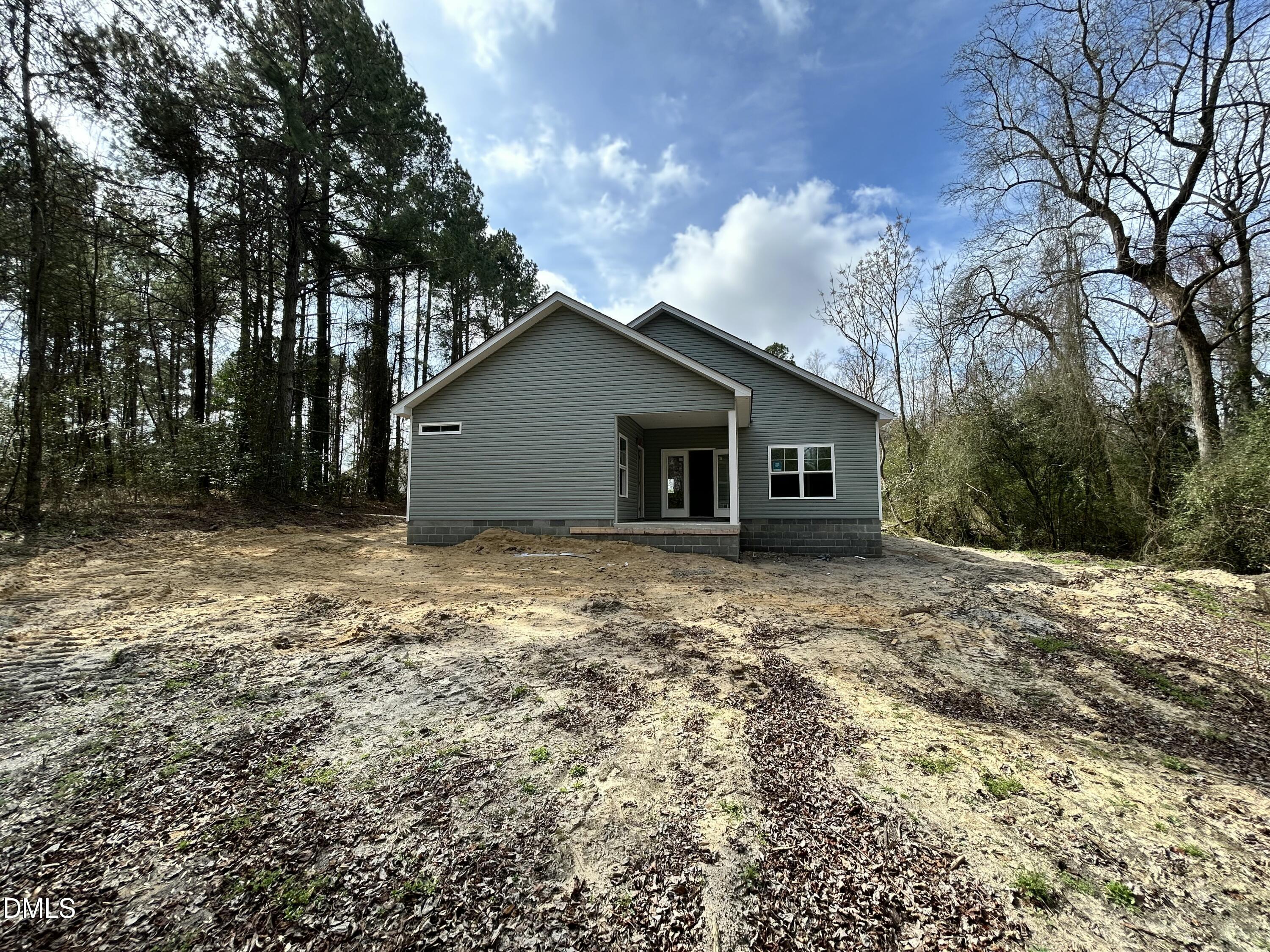 1702 Cardinal Drive Deep Run, NC 28525 - Photo 14 of 21 a view of a house with a yard