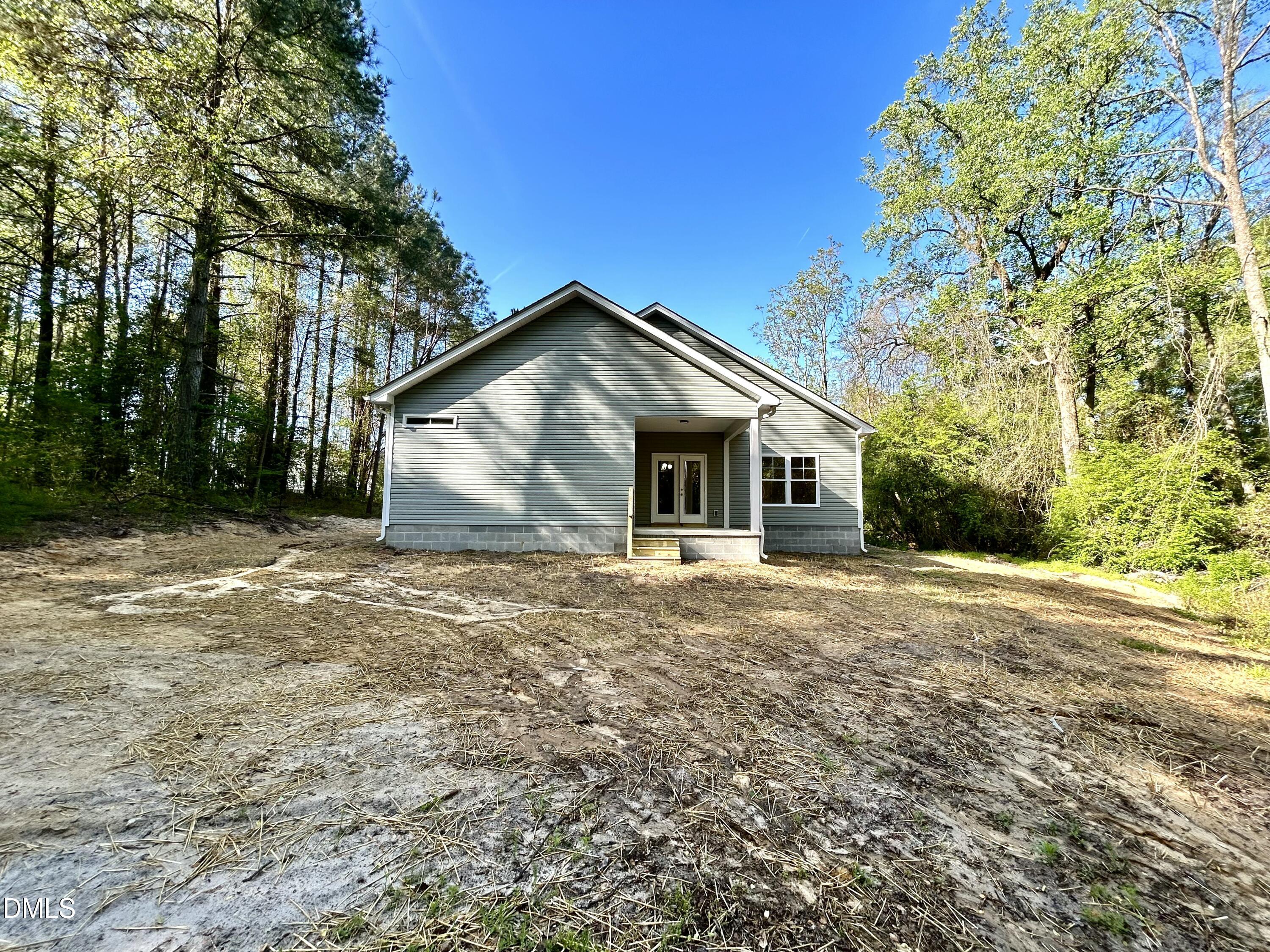 1702 Cardinal Drive Deep Run, NC 28525 - Photo 16 of 21 a front view of house with yard and trees