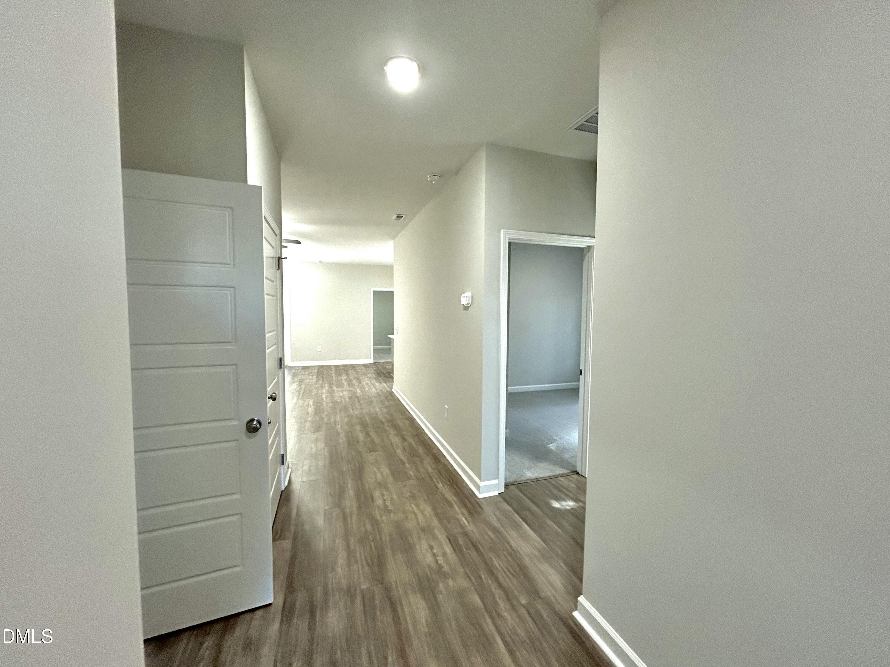 1702 Cardinal Drive Deep Run, NC 28525 - Photo 2 of 21 a view of hallway with wooden floor