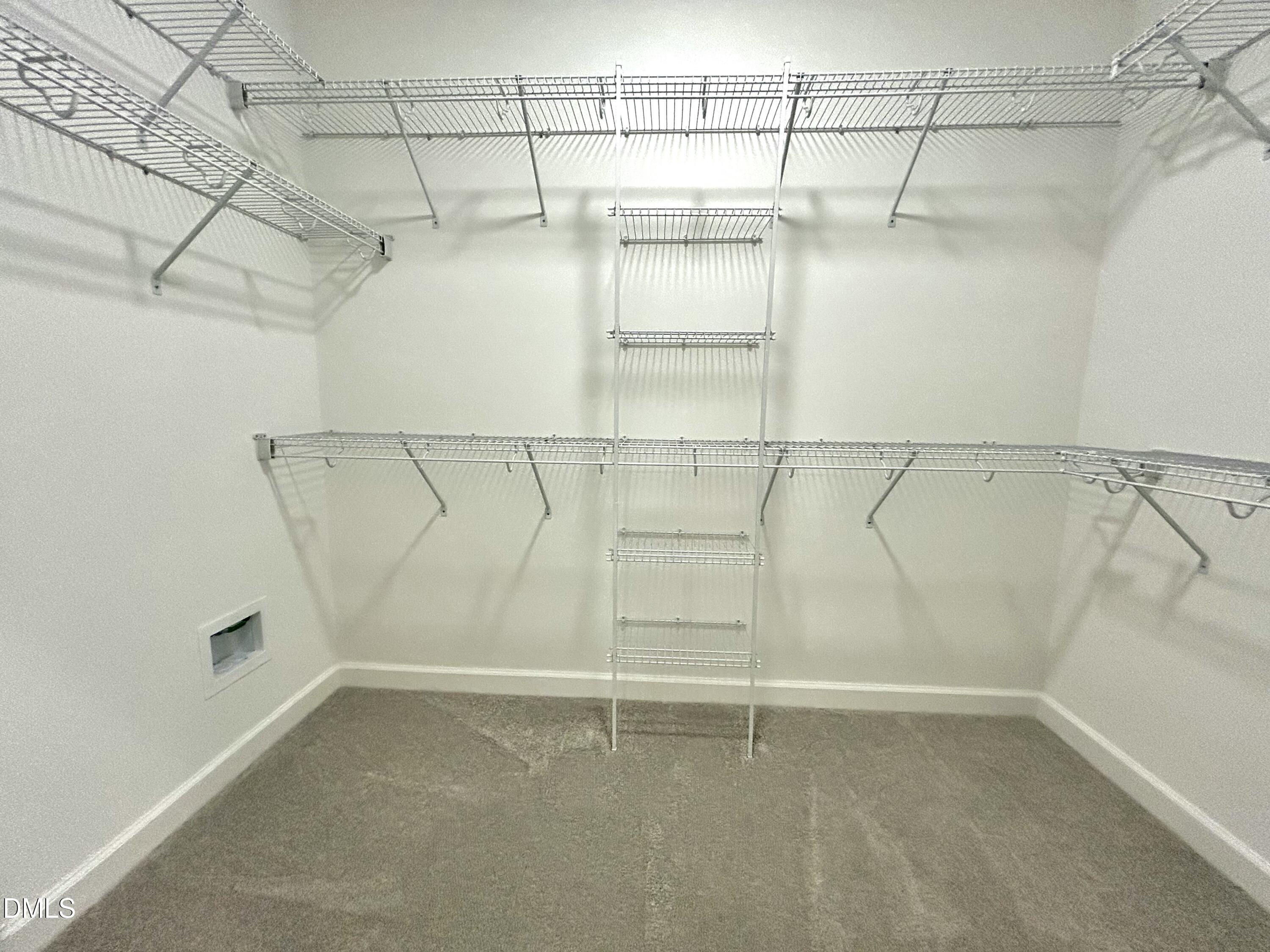 1702 Cardinal Drive Deep Run, NC 28525 - Photo 21 of 21 a view of a room with racks on the wall