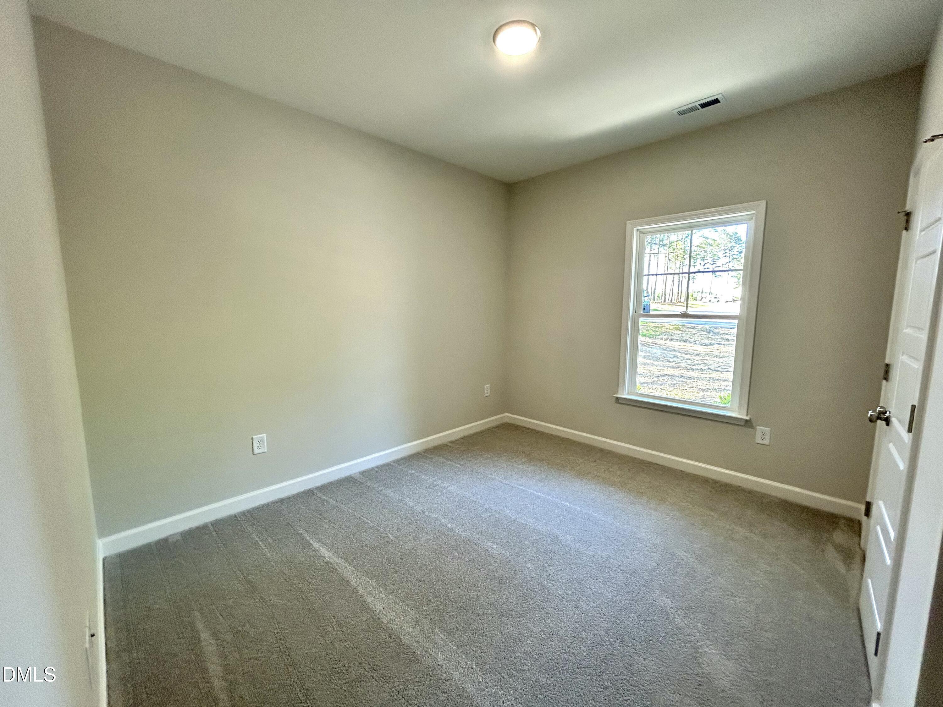 1702 Cardinal Drive Deep Run, NC 28525 - Photo 5 of 21 an empty room with a window