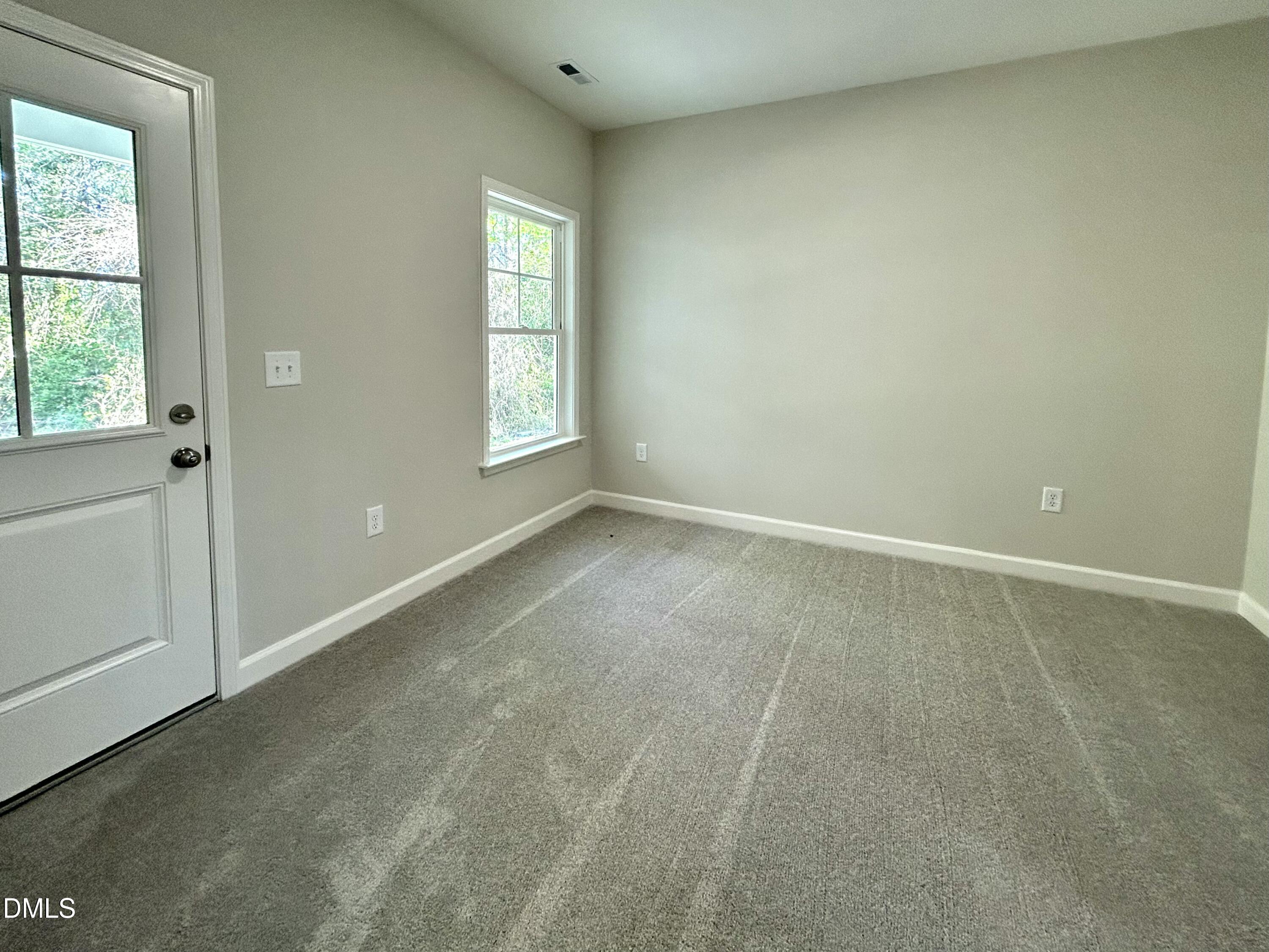 1702 Cardinal Drive Deep Run, NC 28525 - Photo 10 of 21 an empty room with windows