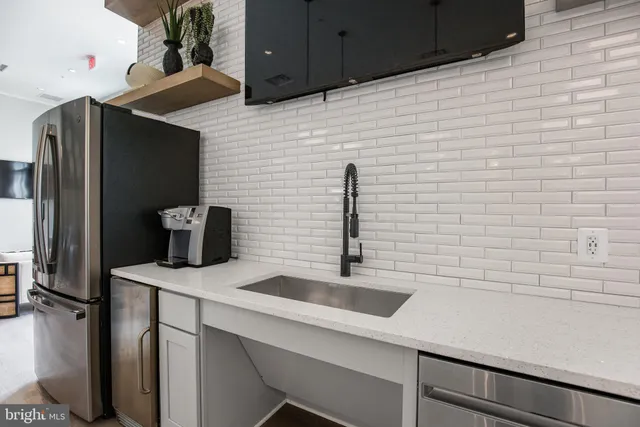 a kitchen with a table and chairs in it